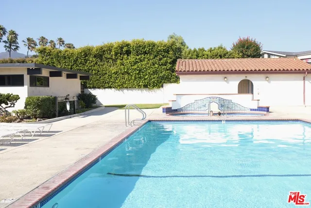 a view of a swimming pool with a patio