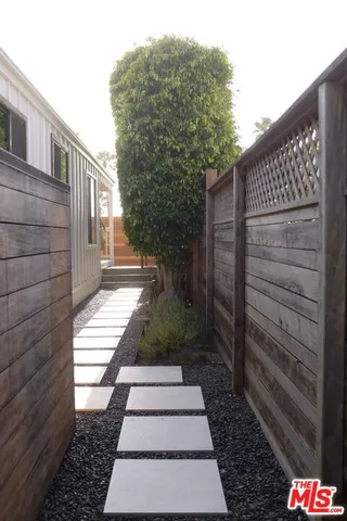 a view of a pathway with a house