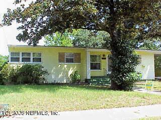1237 Ribault River Drive Jacksonville, FL 32208 - Photo 1 of 1 front view of house with a yard