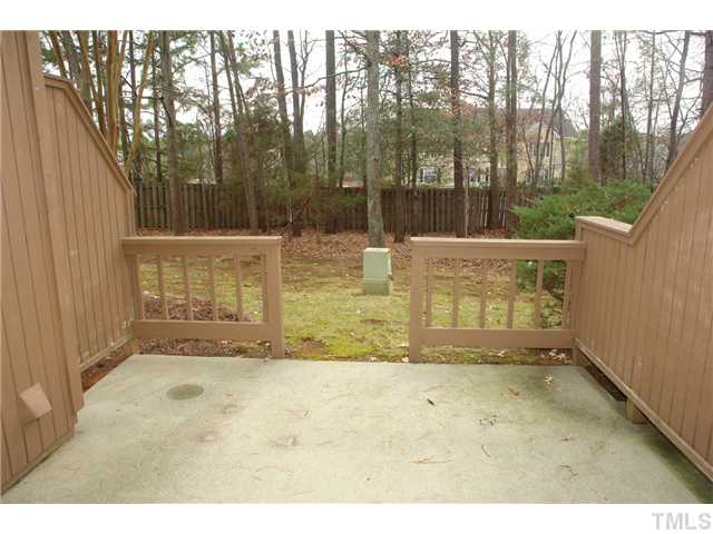 4203 Sunscape Lane Raleigh, NC 27613 - Photo 12 of 15 a view of outdoor space with deck and tree