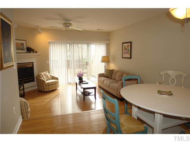 4203 Sunscape Lane Raleigh, NC 27613 - Photo 6 of 15 a living room with furniture and a fireplace