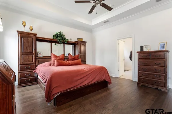 a bedroom with a bed and a dresser