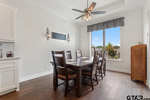 a view of a dining room with furniture window and wooden floor