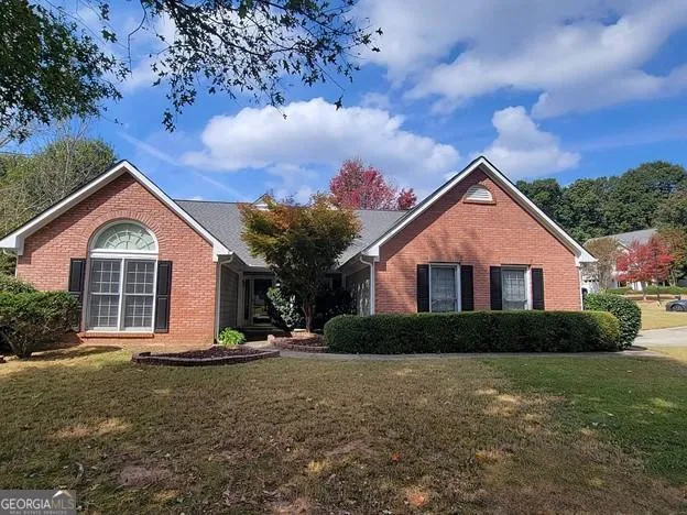 a front view of a house with a yard