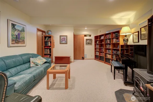 a living room with a couch and bookshelf