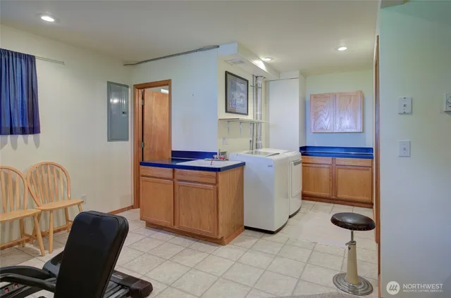 a kitchen with a sink cabinets and window