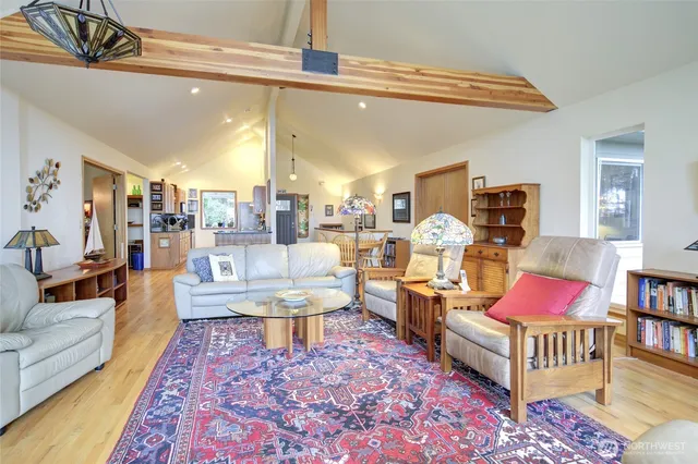 a living room with furniture and a rug