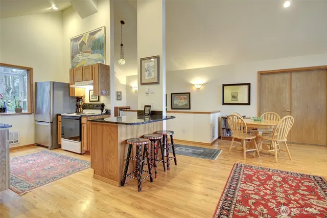 a living room with lots of furniture and a rug