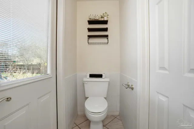 a spacious bedroom with a large bed and a flat screen tv