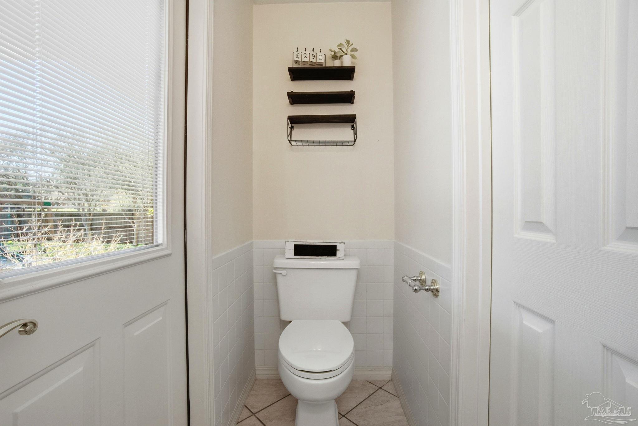 1805 West 10 Mile Road Pensacola, FL 32534 - Photo 11 of 61 a bathroom with a toilet and a sink