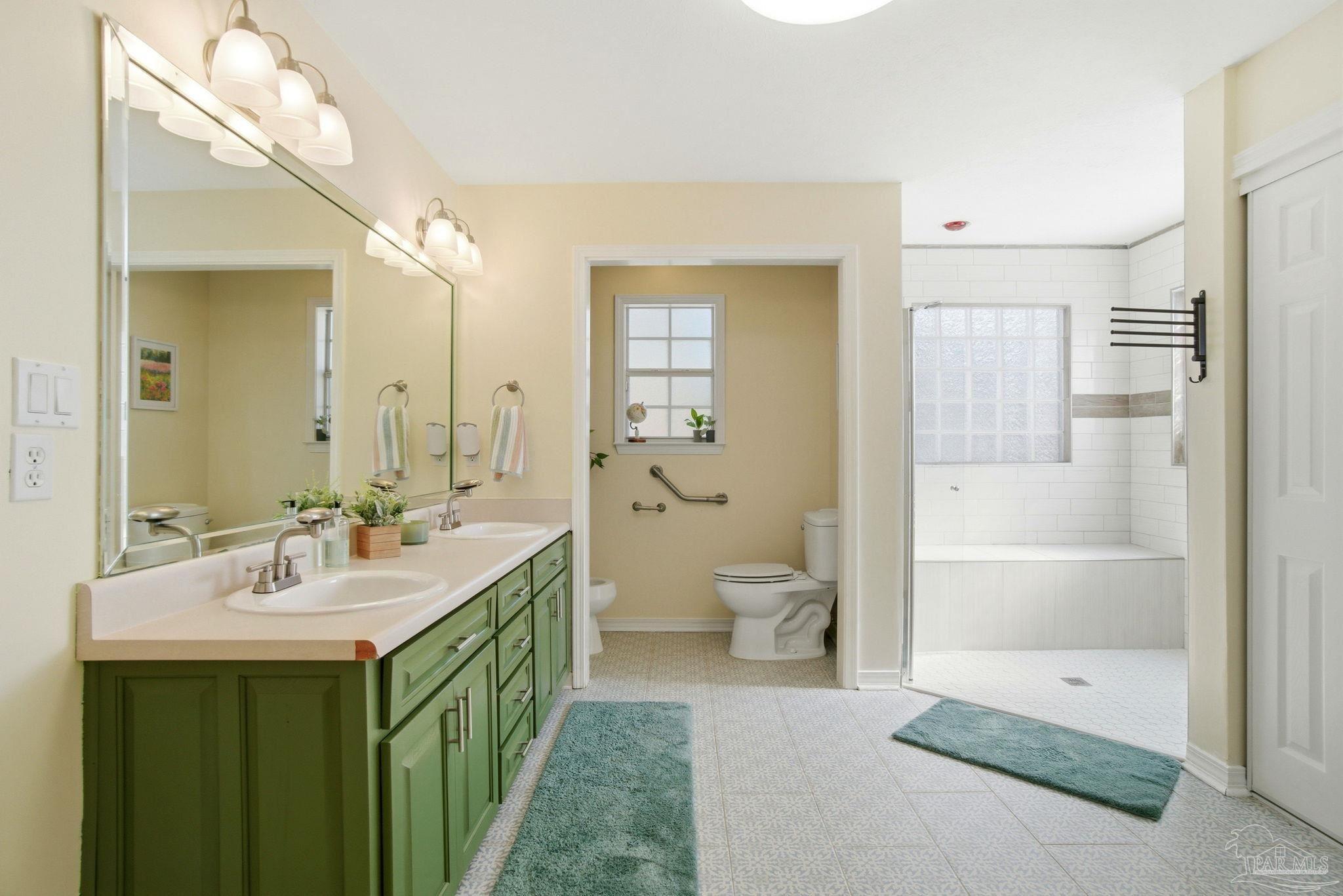 1805 West 10 Mile Road Pensacola, FL 32534 - Photo 14 of 61 a bathroom with a double vanity sink mirror and a bathtub