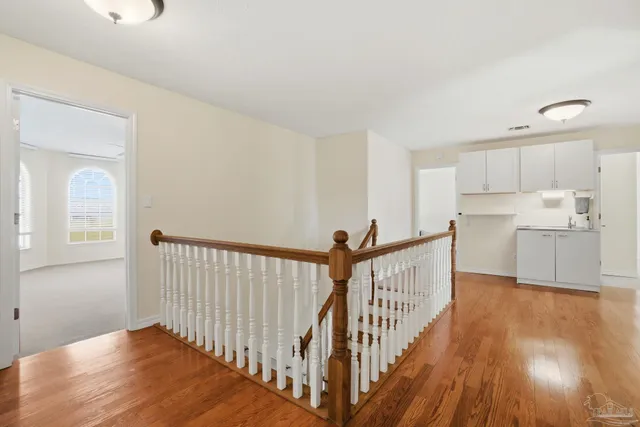 a bedroom with a bed and a chair