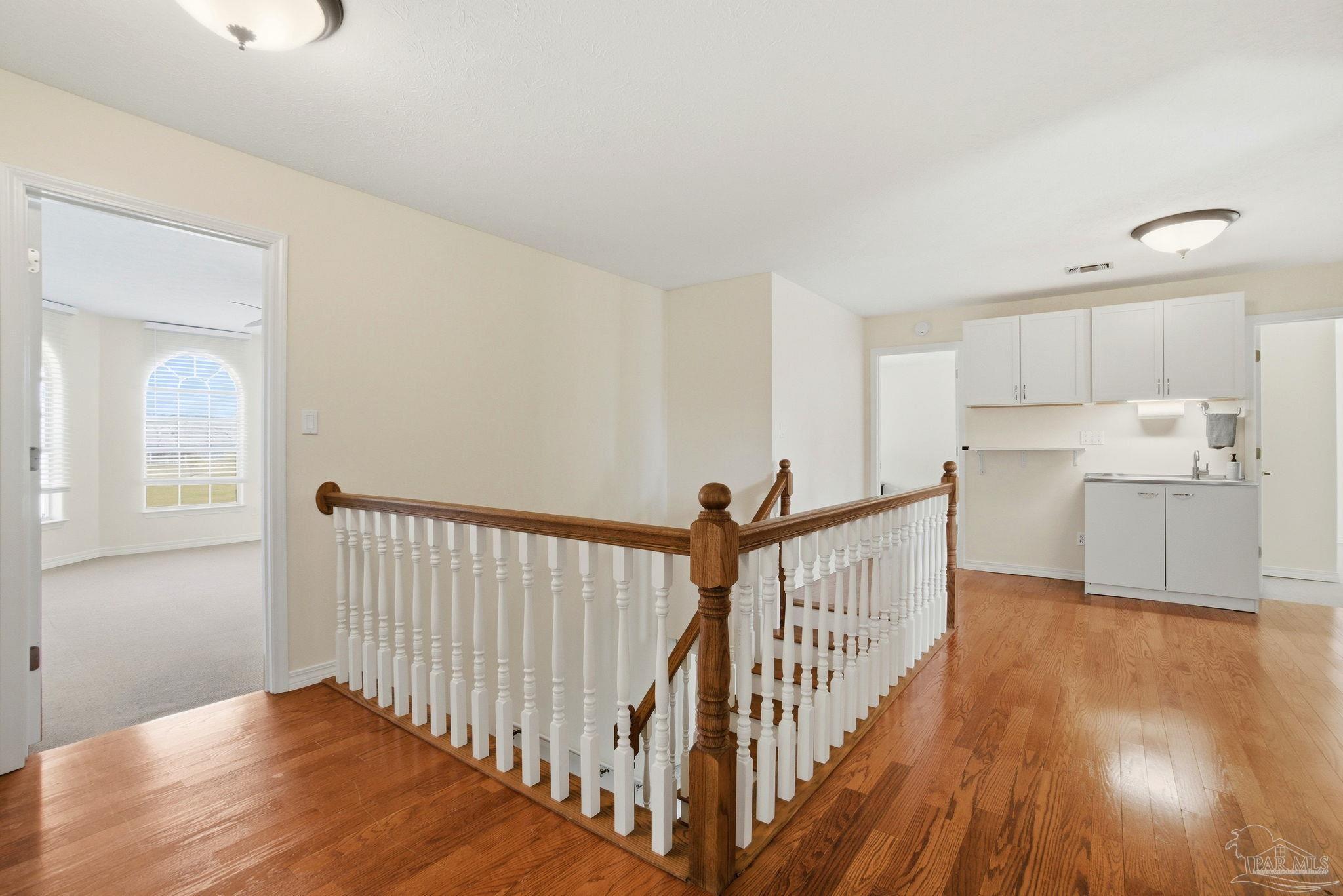 1805 West 10 Mile Road Pensacola, FL 32534 - Photo 15 of 61 a view of a hallway with wooden floor and staircase