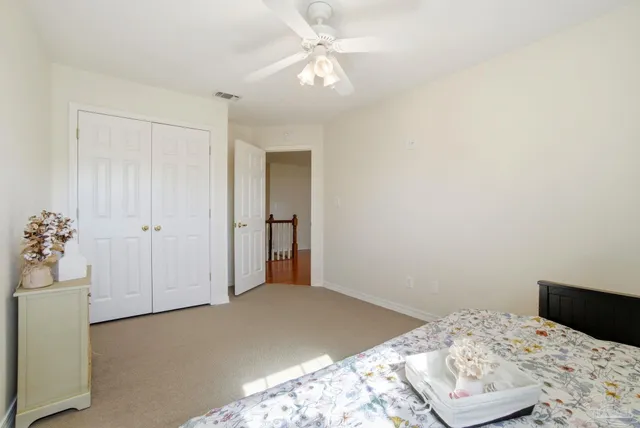 a bedroom with furniture and a window
