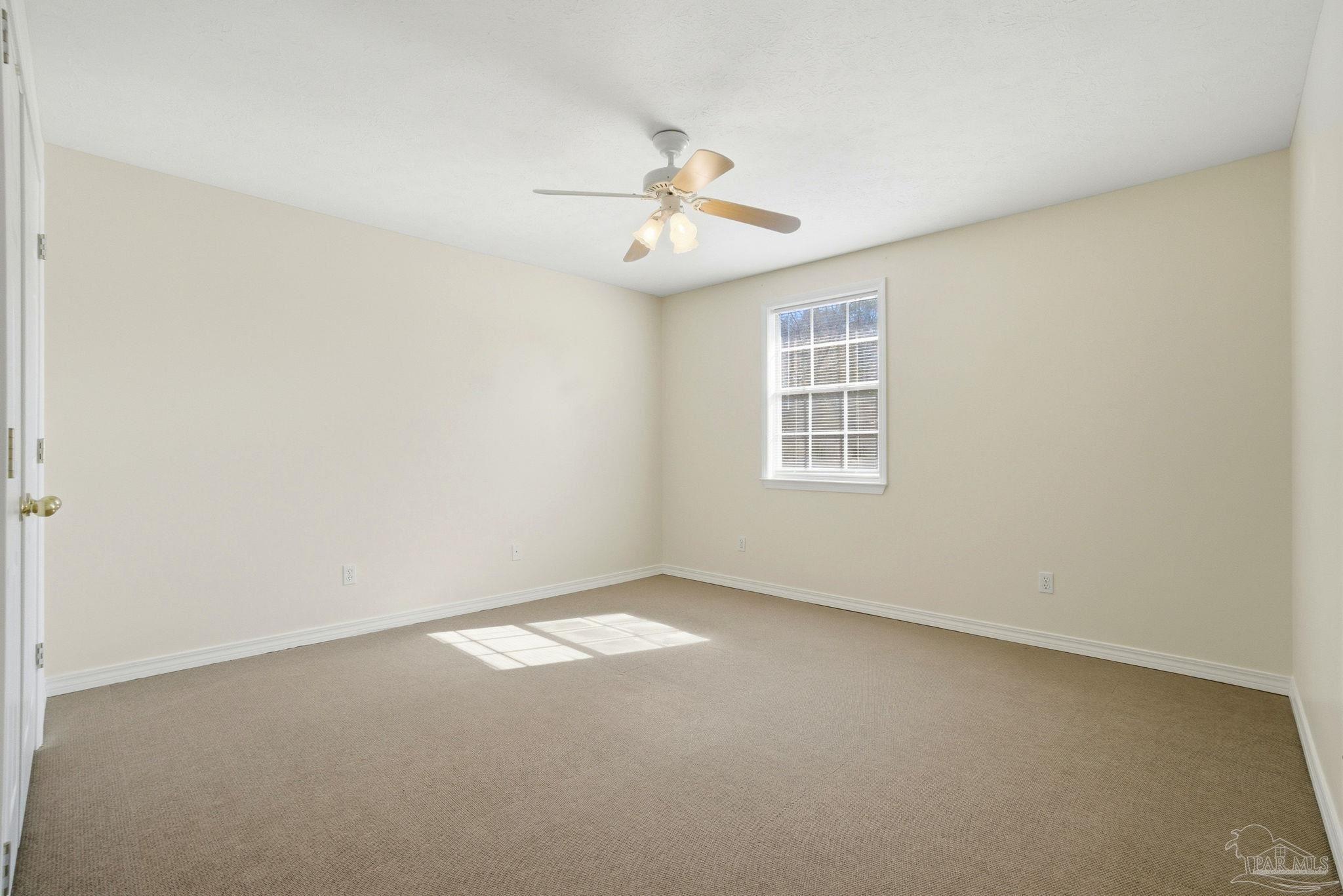 1805 West 10 Mile Road Pensacola, FL 32534 - Photo 20 of 61 an empty room with windows and fan