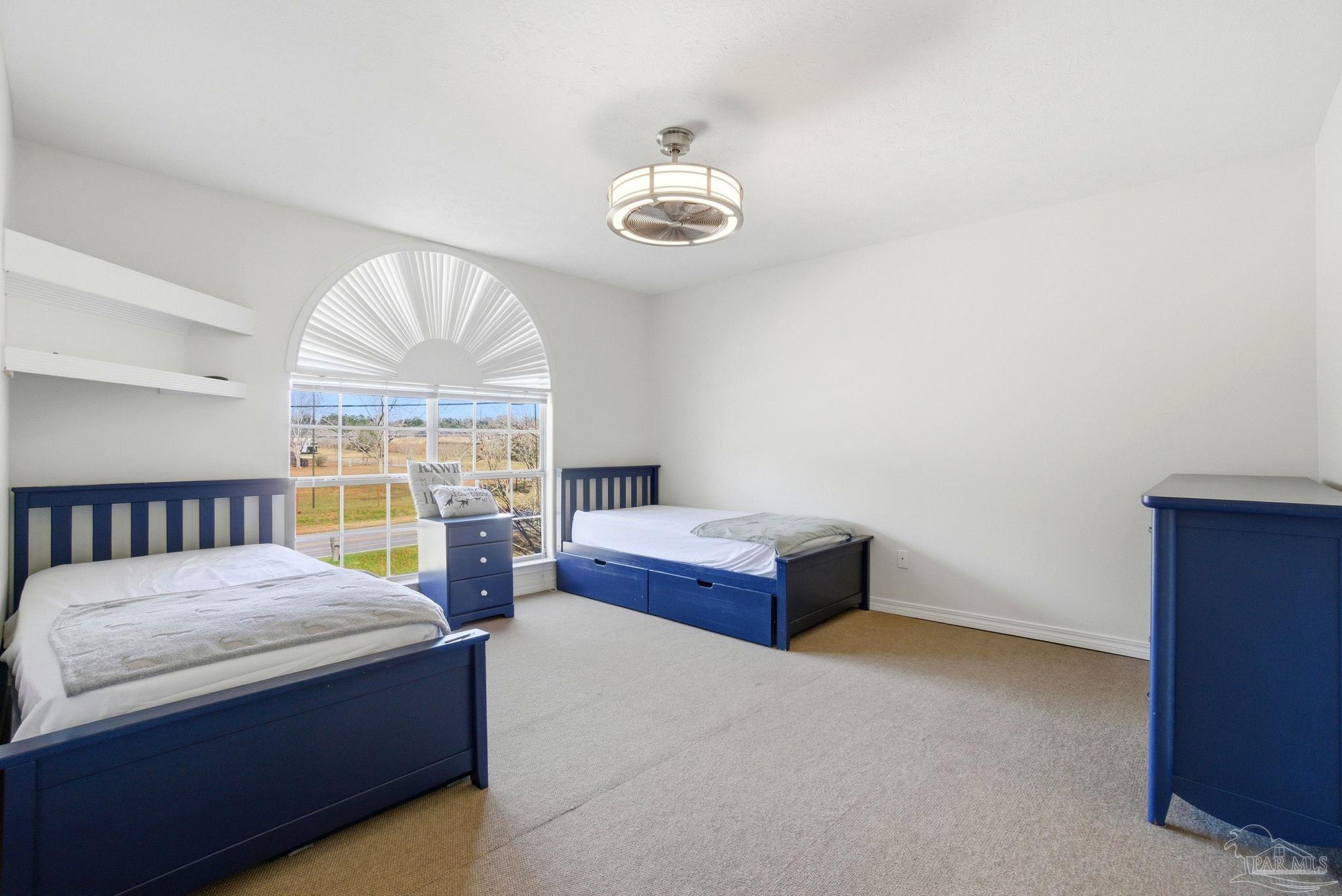 1805 West 10 Mile Road Pensacola, FL 32534 - Photo 21 of 61 a bedroom with furniture and a window