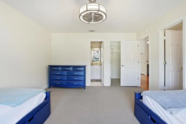 a bathroom with a shower and a table