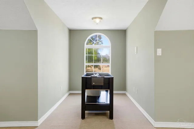 a view of a swimming pool with seating area