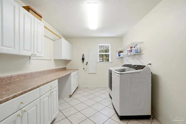 a view of a house with pool and chairs