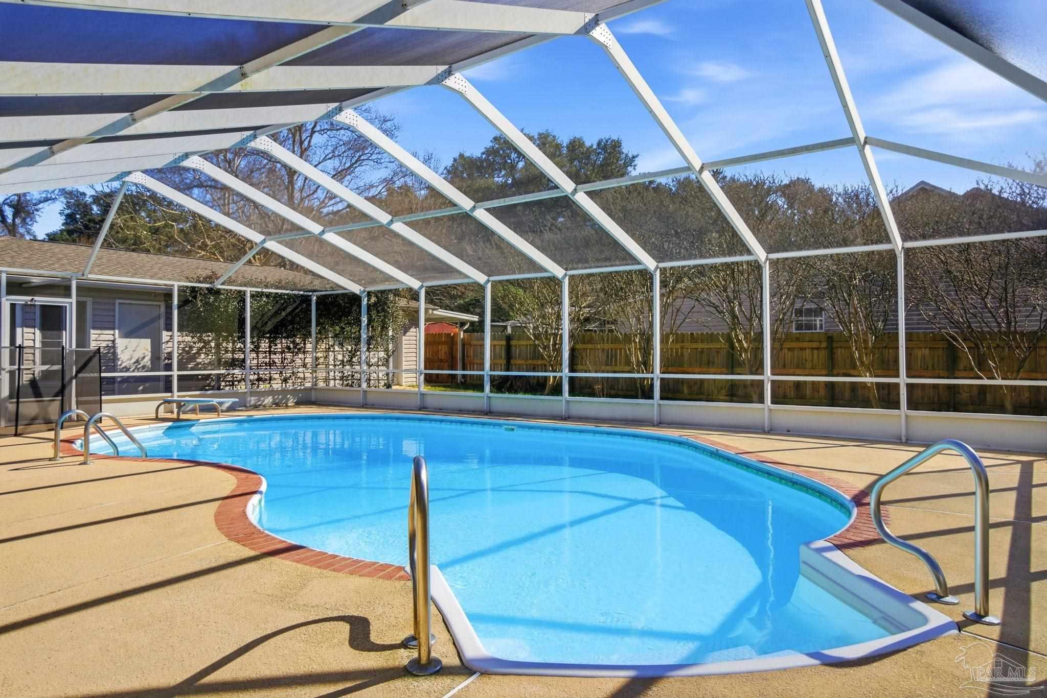 1805 West 10 Mile Road Pensacola, FL 32534 - Photo 34 of 61 a view of a swimming pool with seating area