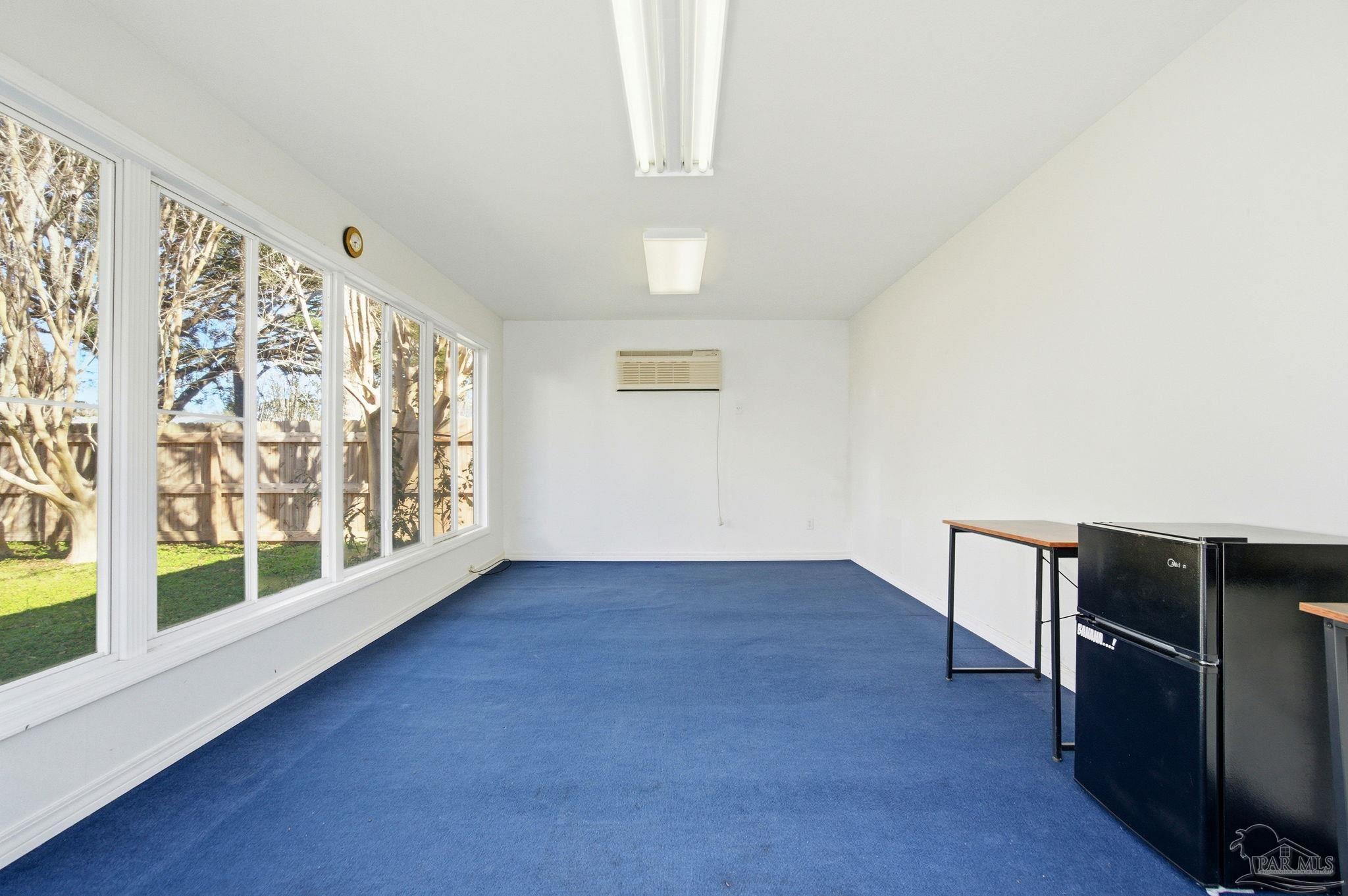 1805 West 10 Mile Road Pensacola, FL 32534 - Photo 39 of 61 a view of an empty room with wooden floor and a window