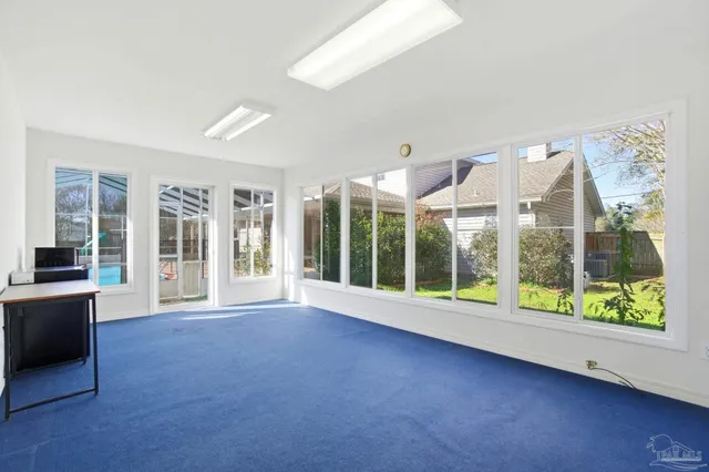 a aerial view of a house next to a yard