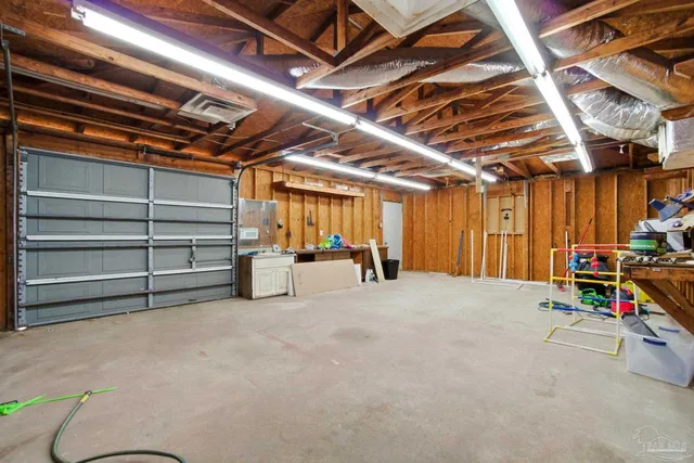 a aerial view of a house next to a yard
