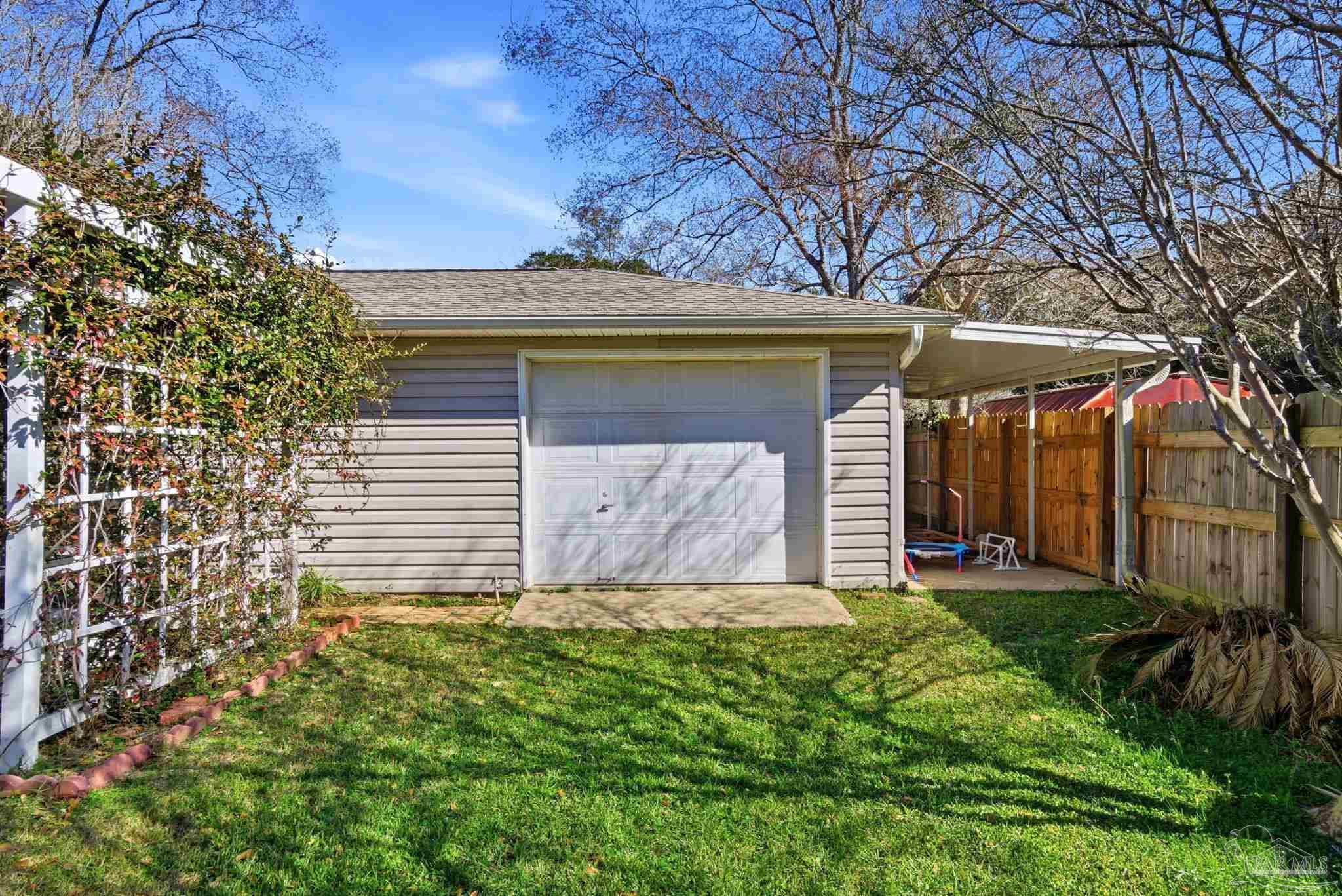 1805 West 10 Mile Road Pensacola, FL 32534 - Photo 44 of 61 a view of a house with a yard
