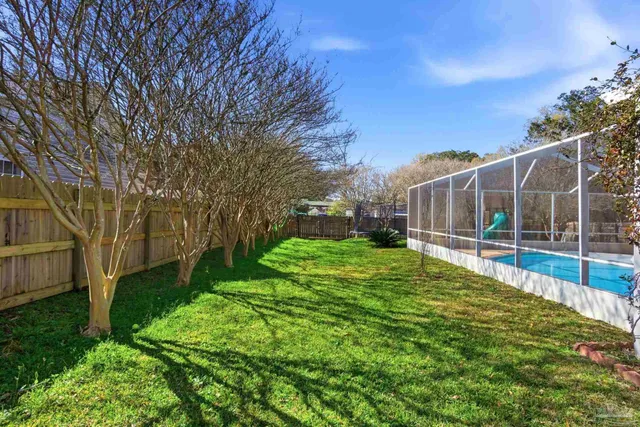 an aerial view of a houses with yard