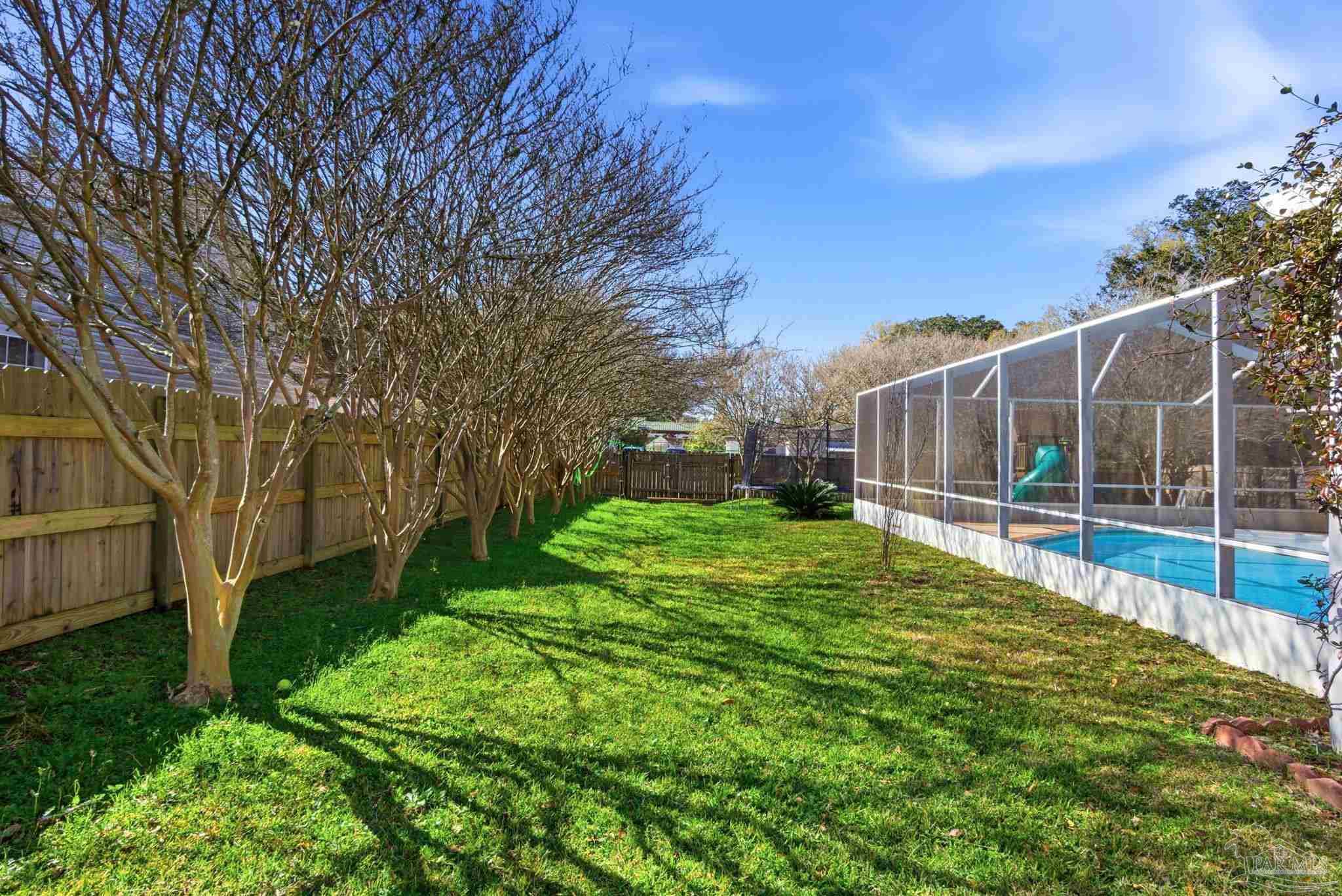 1805 West 10 Mile Road Pensacola, FL 32534 - Photo 45 of 61 a view of a backyard with a small cabin