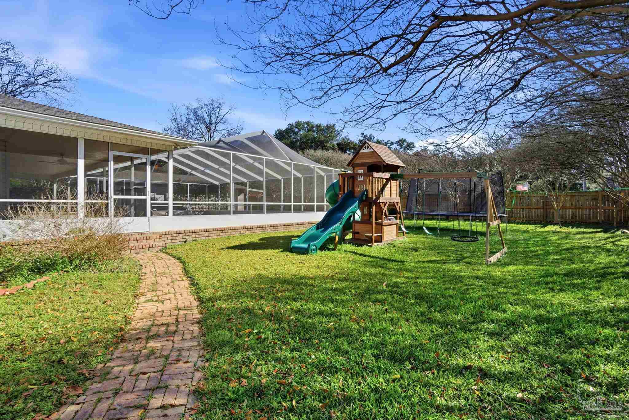 1805 West 10 Mile Road Pensacola, FL 32534 - Photo 48 of 61 a view of a house with a backyard