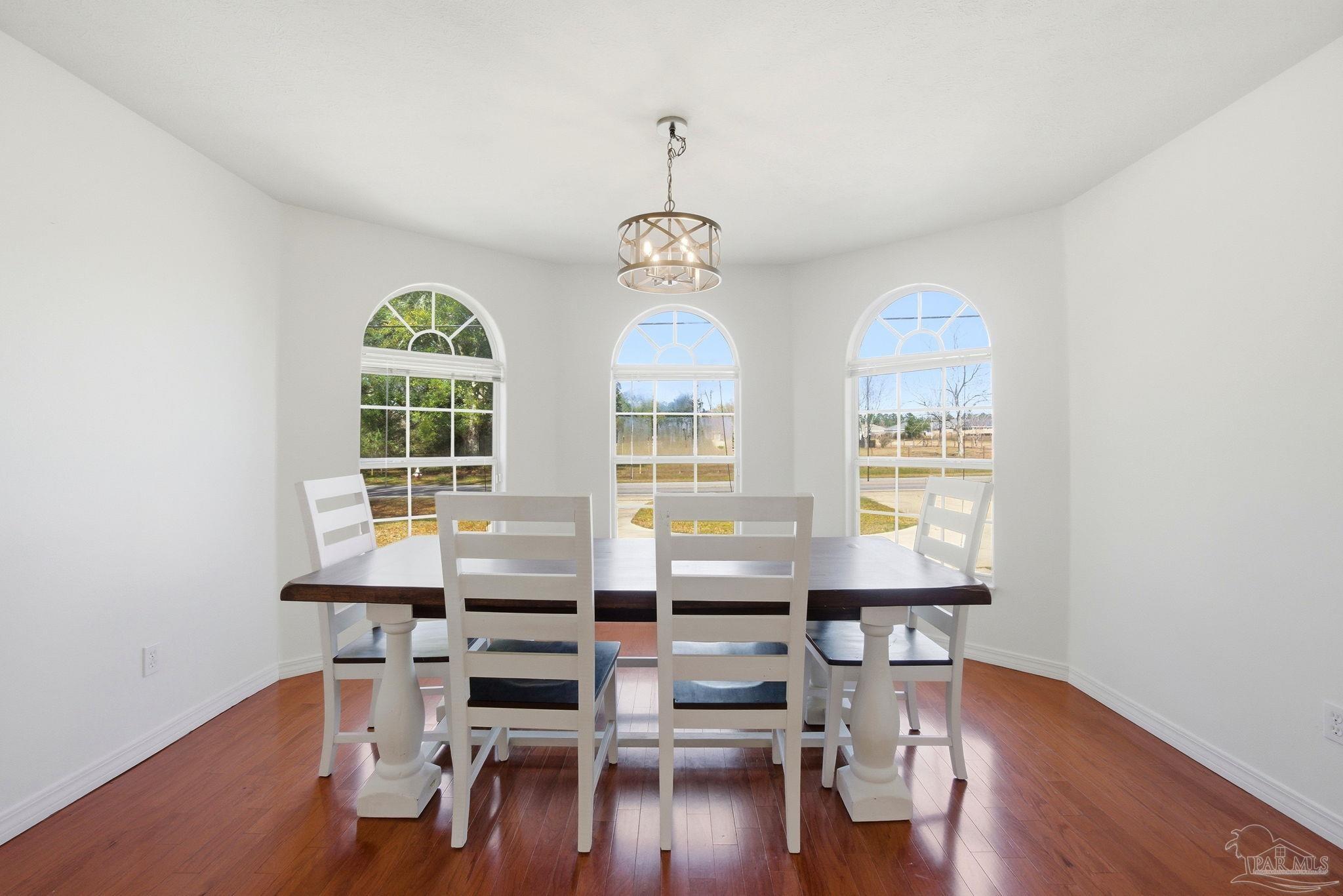 1805 West 10 Mile Road Pensacola, FL 32534 - Photo 5 of 61 a view of a dining room with furniture window and wooden floor