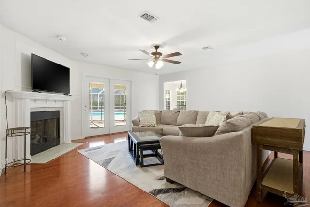 a view of a dining room with furniture and chandelier