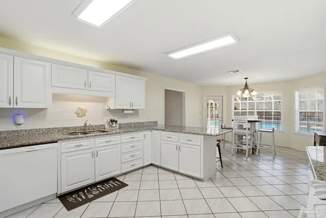 a bathroom with a sink a mirror and a shower