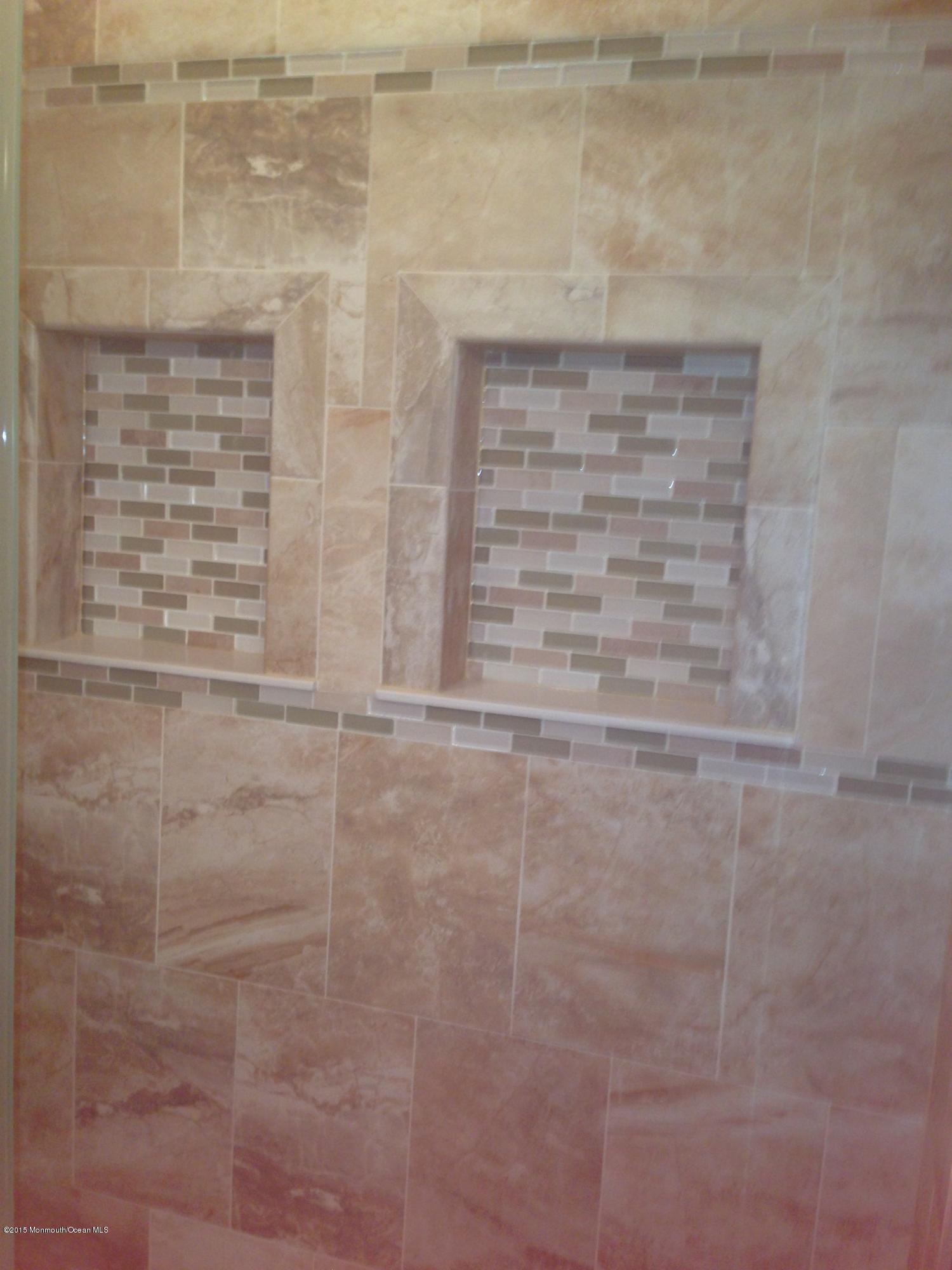 94 Halls Croft Road, Unit B Freehold, NJ 07728 - Photo 8 of 12 a bathroom with a shower