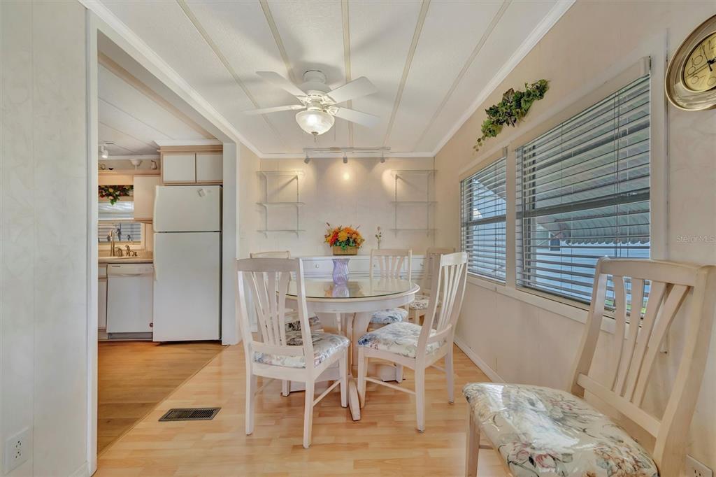 124 St Pierres Way Apollo Beach, FL 33572 - Photo 22 of 56 a view of a dining room with furniture and wooden floor
