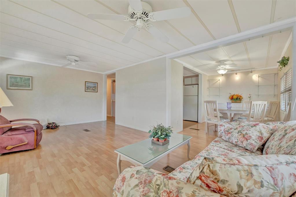 124 St Pierres Way Apollo Beach, FL 33572 - Photo 23 of 56 a living room with furniture and a chandelier