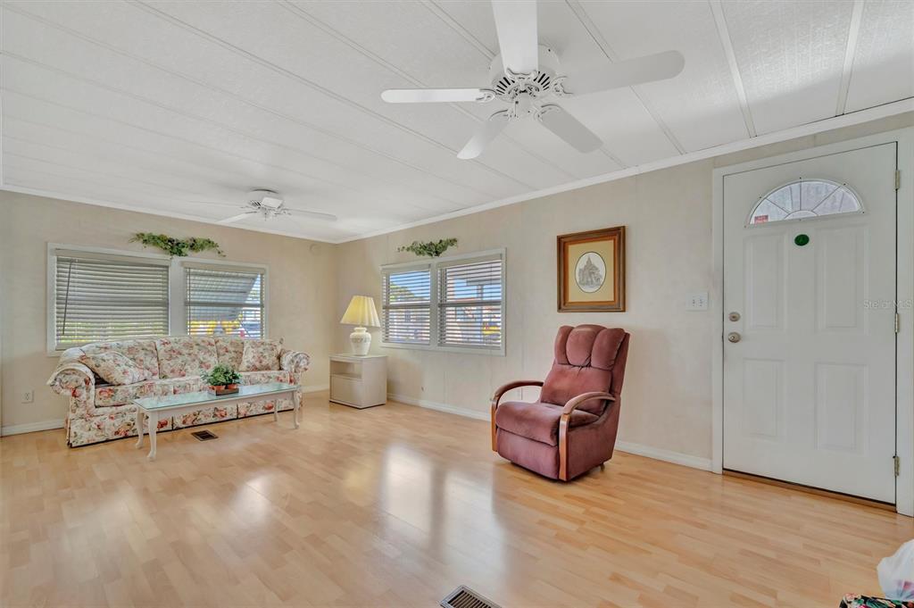 124 St Pierres Way Apollo Beach, FL 33572 - Photo 25 of 56 a living room with furniture window and wooden floor