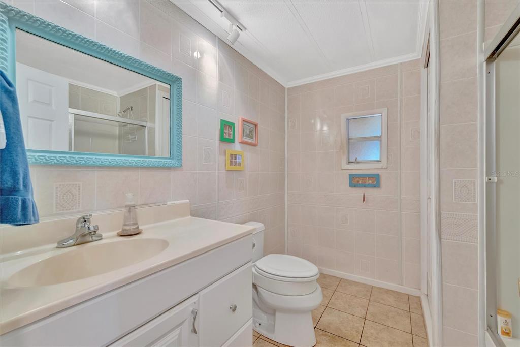 124 St Pierres Way Apollo Beach, FL 33572 - Photo 27 of 56 a bathroom with a sink a toilet and mirror