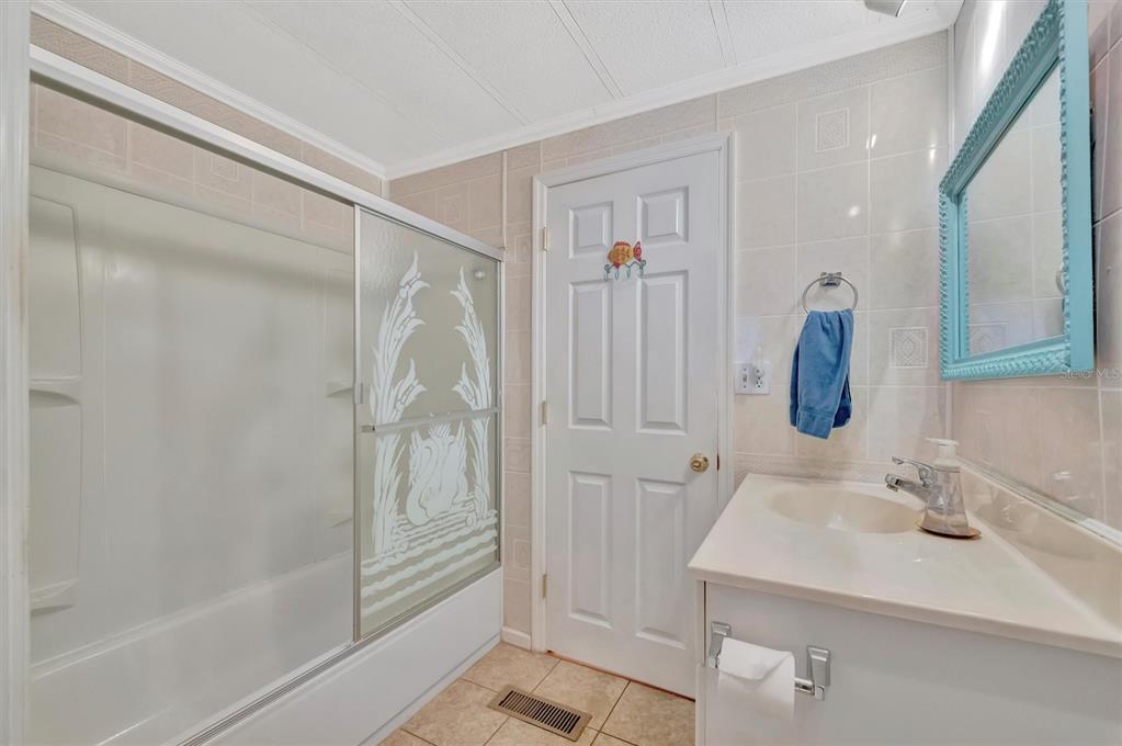 124 St Pierres Way Apollo Beach, FL 33572 - Photo 28 of 56 a bathroom with a sink and a mirror