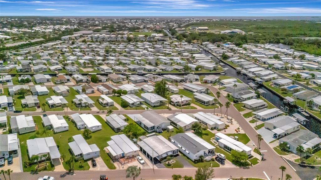 124 St Pierres Way Apollo Beach, FL 33572 - Photo 39 of 56 an aerial view of residential houses with outdoor space