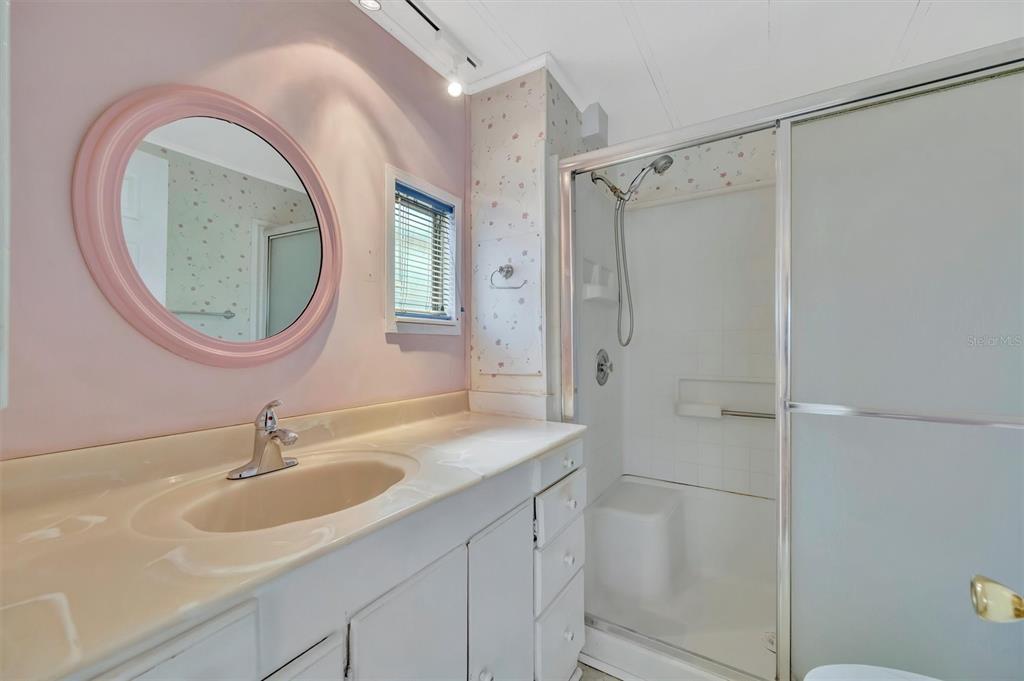 124 St Pierres Way Apollo Beach, FL 33572 - Photo 42 of 56 a bathroom with a sink a toilet and a mirror