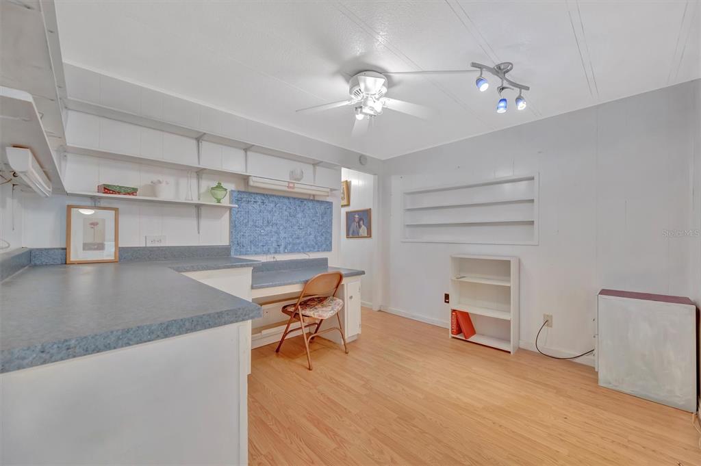 124 St Pierres Way Apollo Beach, FL 33572 - Photo 44 of 56 a living room with furniture and a chandelier