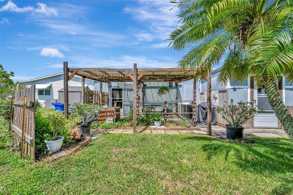 124 St Pierres Way Apollo Beach, FL 33572 - Photo 48 of 56 a view of a chair and table in backyard of the house