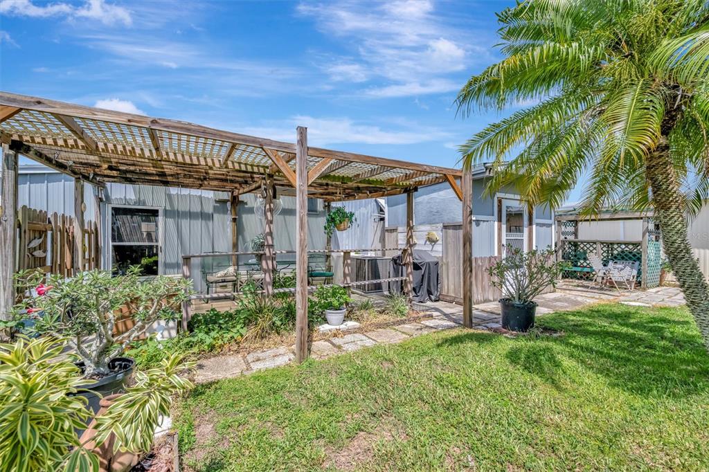 124 St Pierres Way Apollo Beach, FL 33572 - Photo 50 of 56 a view of a house with a yard patio and plants