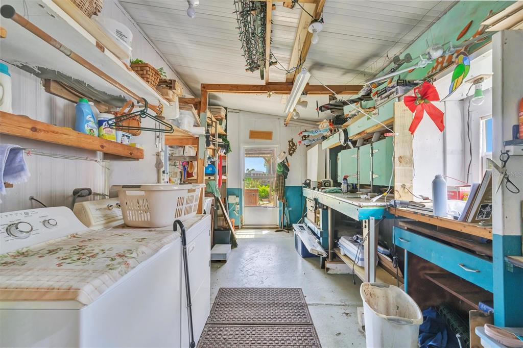 124 St Pierres Way Apollo Beach, FL 33572 - Photo 55 of 56 a utility room with stainless steel appliances lots of counter and chairs