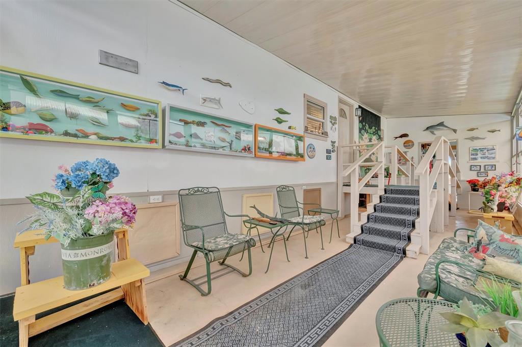 124 St Pierres Way Apollo Beach, FL 33572 - Photo 56 of 56 a living room with furniture and flowers
