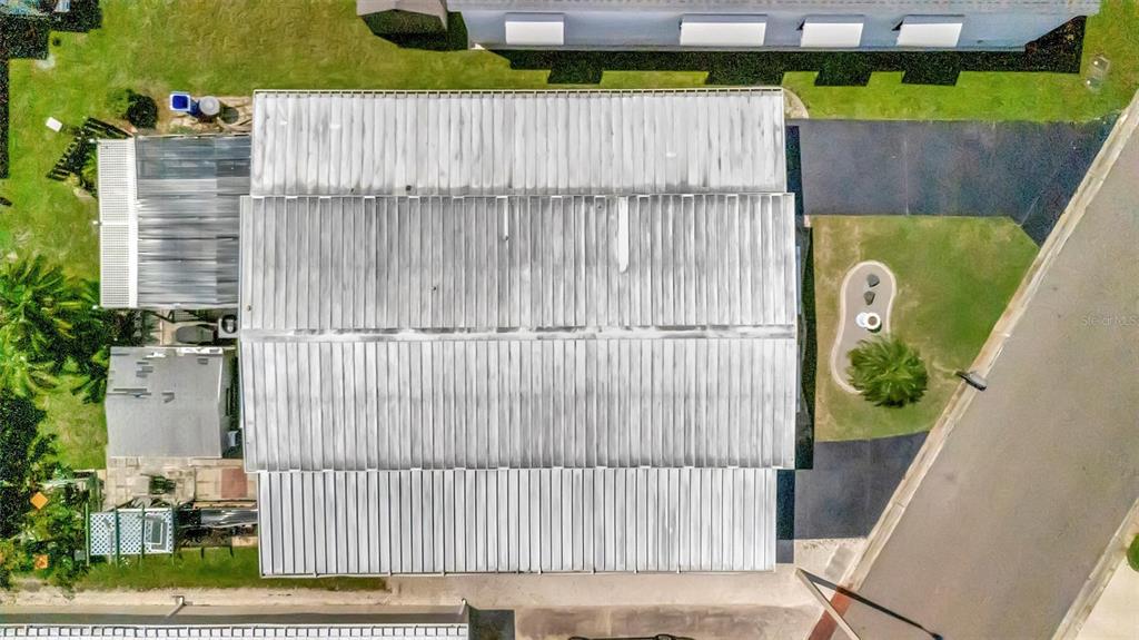 124 St Pierres Way Apollo Beach, FL 33572 - Photo 8 of 56 a view of a small yard with wooden fence