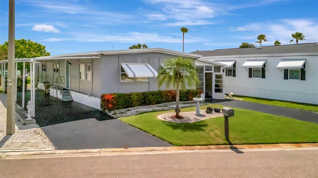 124 St Pierres Way Apollo Beach, FL 33572 - Photo 10 of 56 a view of a house with a swimming pool and sitting area