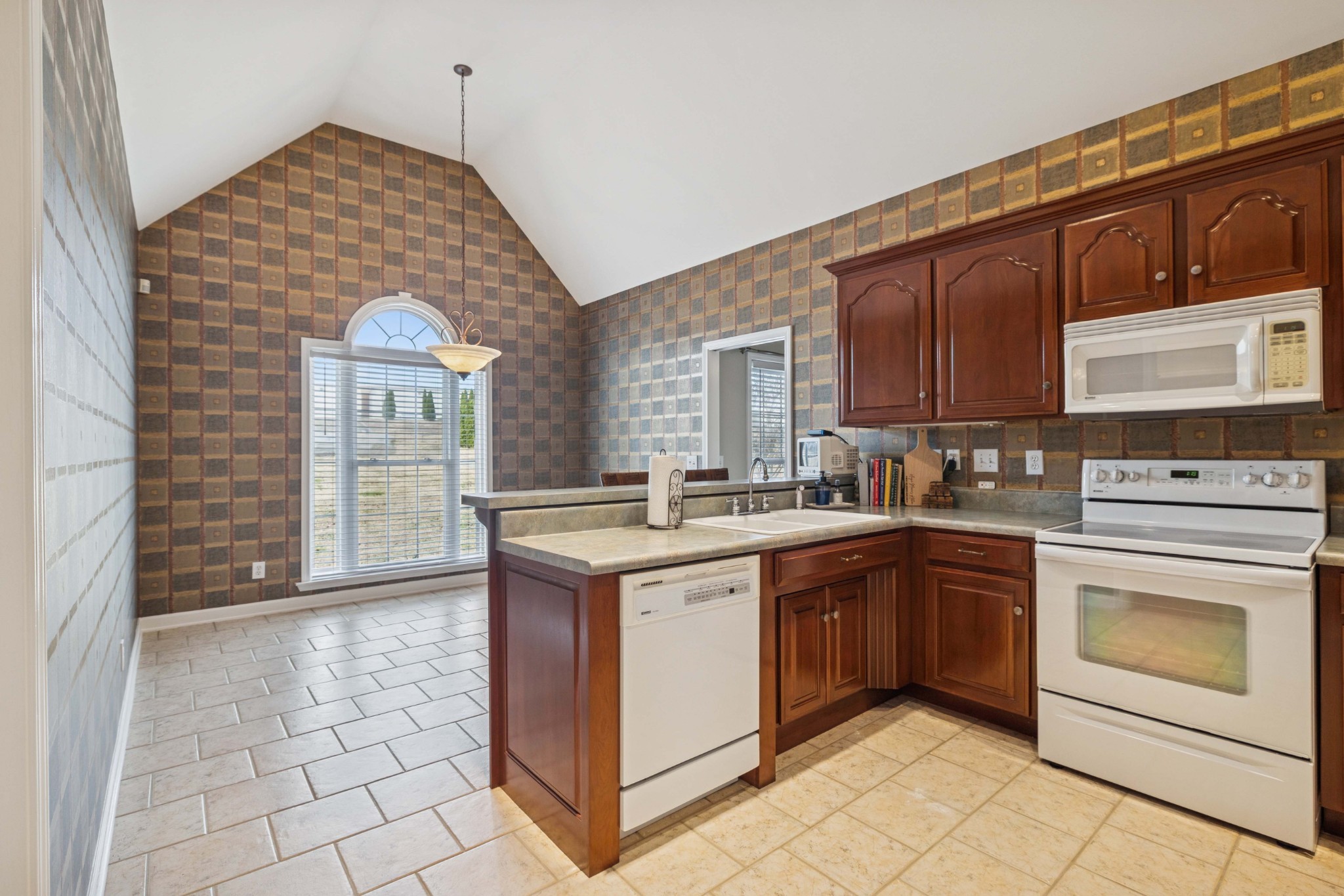 1205 Rock Springs Road Smyrna, TN 37167 - Photo 12 of 48 a kitchen with stainless steel appliances granite countertop a stove a sink and a refrigerator